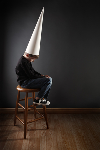 boy in dunce cap